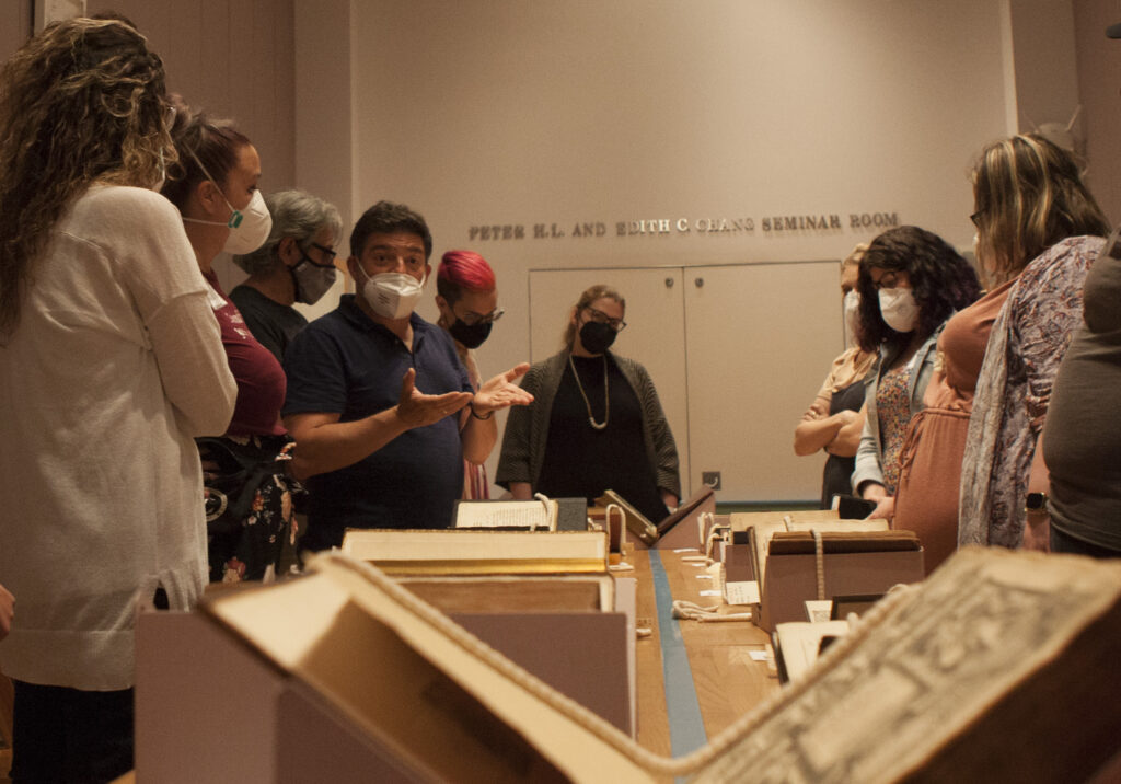 NEH Institute participants examine a First Folio of Shakespeare's works at Columbia University's Rare Book Room, under the guidance of Shakespeare scholars.